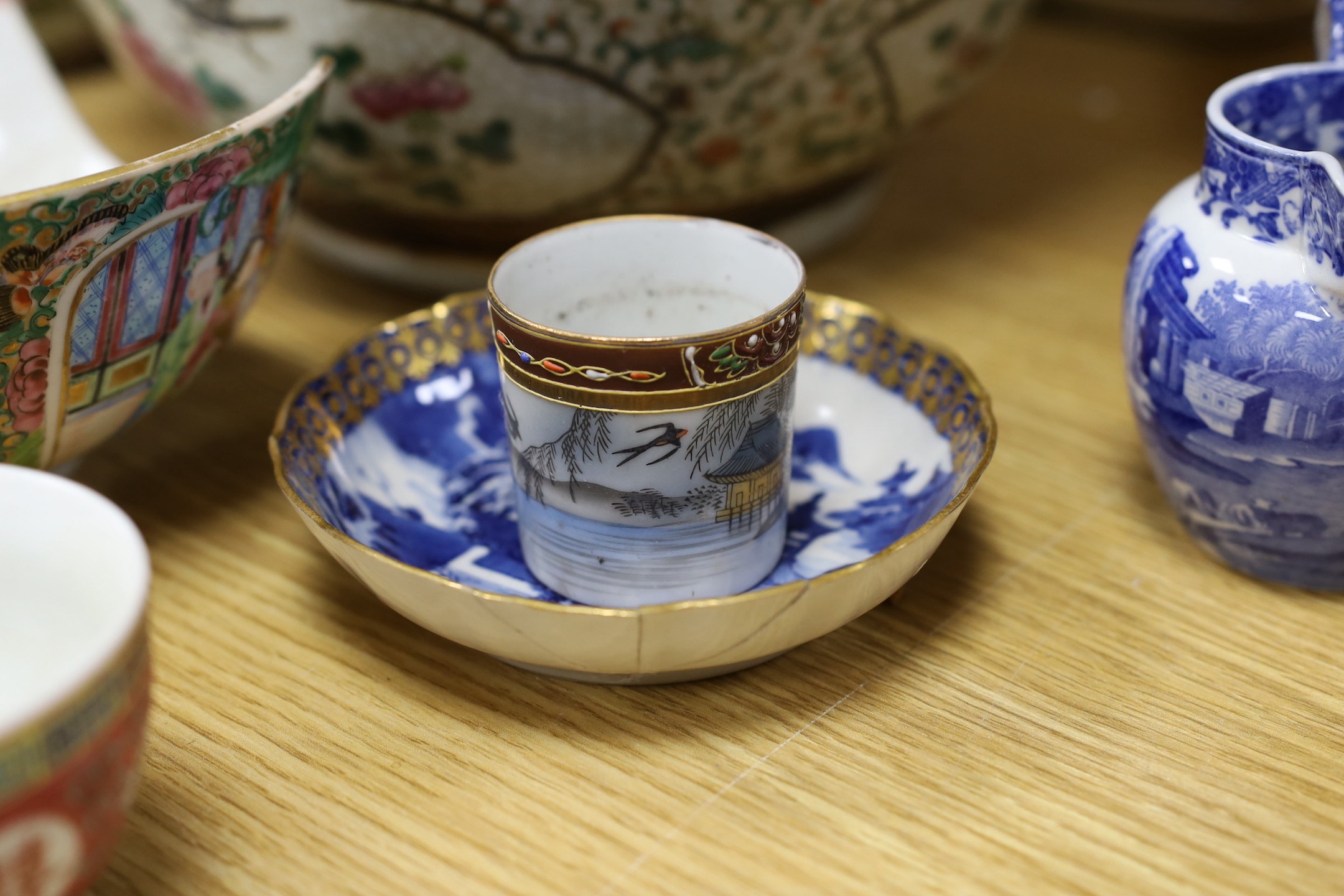 A group of mixed ceramics and an enamel brush